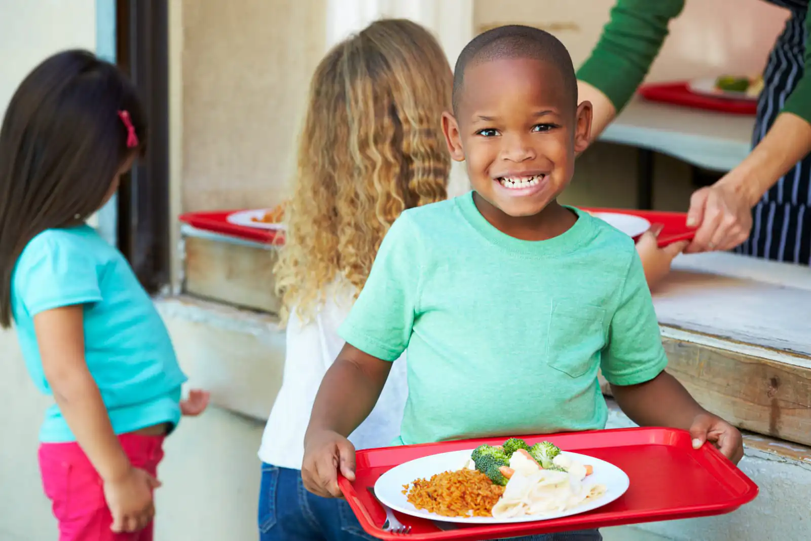 Modern school cafeteria in Kenya with students eating nutritious meals